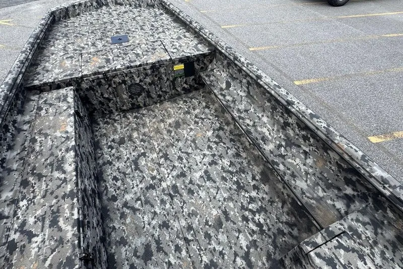 Slide: The Image of 2024 Havoc 1756 boat with camouflage pattern in a parking lot. - 12