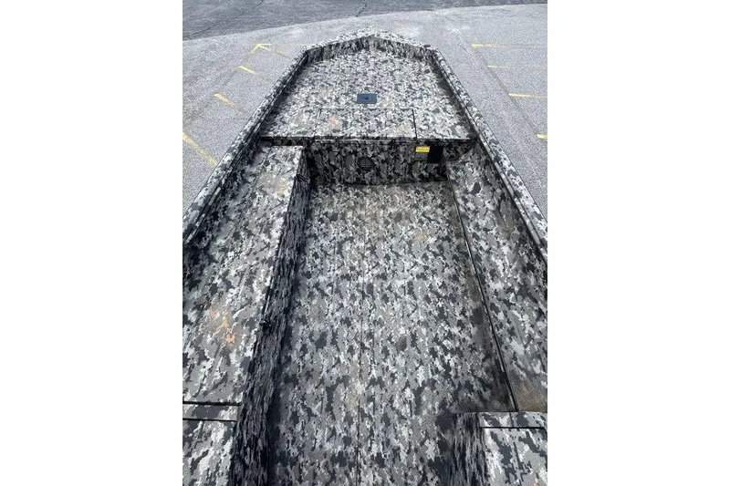 Slide: The Image of 2024 Havoc 1756 boat with camouflage interior, parked on asphalt. - 14