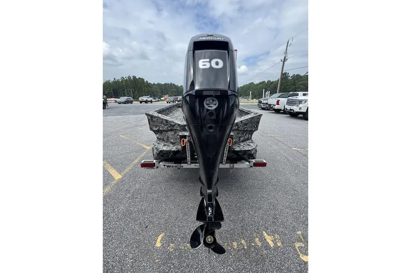 Slide: The Image of 2024 Havoc 1756 boat with Mercury 60 outboard motor on trailer. - 9