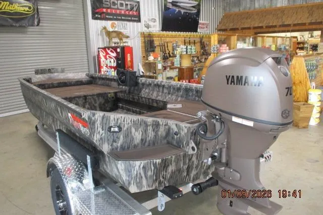 Slide: The Image of 2026 Reaper Boats 756-1687 with Yamaha motor in showroom setting. - 0