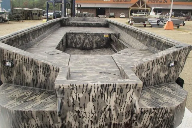 Slide: The Image of Reaper Boats 2026 model 756-1687 interior with camouflage design and spacious deck layout. - 2