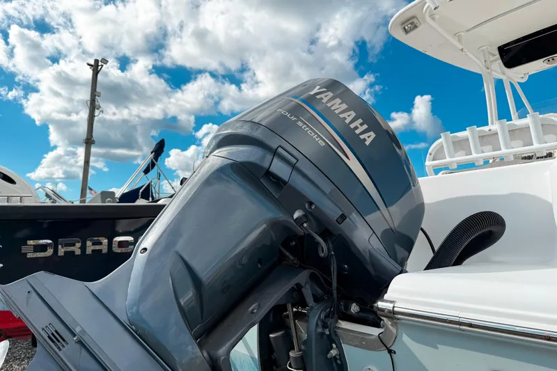 Slide: The Image of Yamaha outboard motor on 2011 Tidewater 230 CC Adventure boat under blue sky. - 2