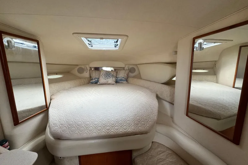 Slide: The Image of Luxurious interior of 2001 Sea Ray 340 Sundancer yacht with cozy bed and mirrors. - 9