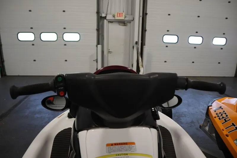 Slide: The Image of 2015 Sea-Doo Spark for 3 jet ski handlebars in a garage setting. - 11