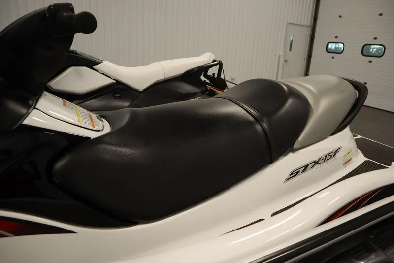 Slide: The Image of 2015 Sea-Doo Spark for 3 jet ski, black and white seat, indoor setting. - 17
