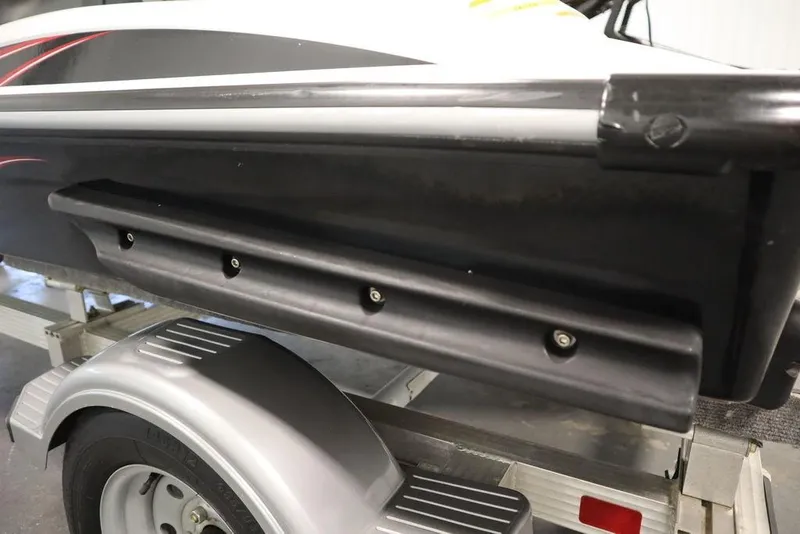 Slide: The Image of 2015 Sea-Doo Spark for 3 on a trailer, showcasing side details and wheel. - 22