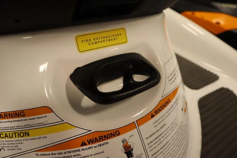 Slide: The Image of 2015 Sea-Doo Spark for 3, fire extinguisher compartment, safety warnings visible. - 23