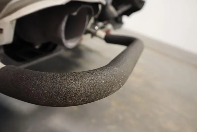 Slide: The Image of Close-up of a 2015 Sea-Doo Spark for 3 handlebar, showcasing textured grip. - 24