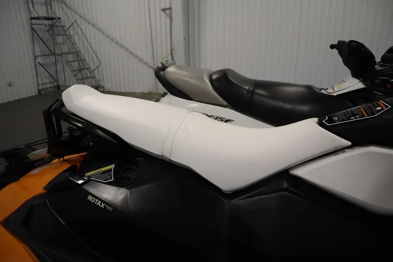 Slide: The Image of 2015 Sea-Doo Spark for 3 jet ski with white and black seating in a storage area. - 28