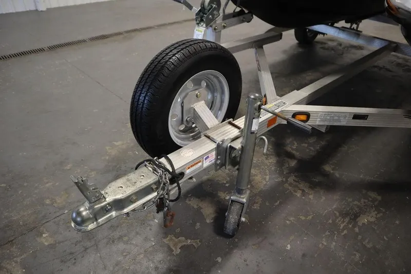 Slide: The Image of Trailer hitch and wheel for 2015 Sea-Doo Spark for 3, parked indoors. - 33