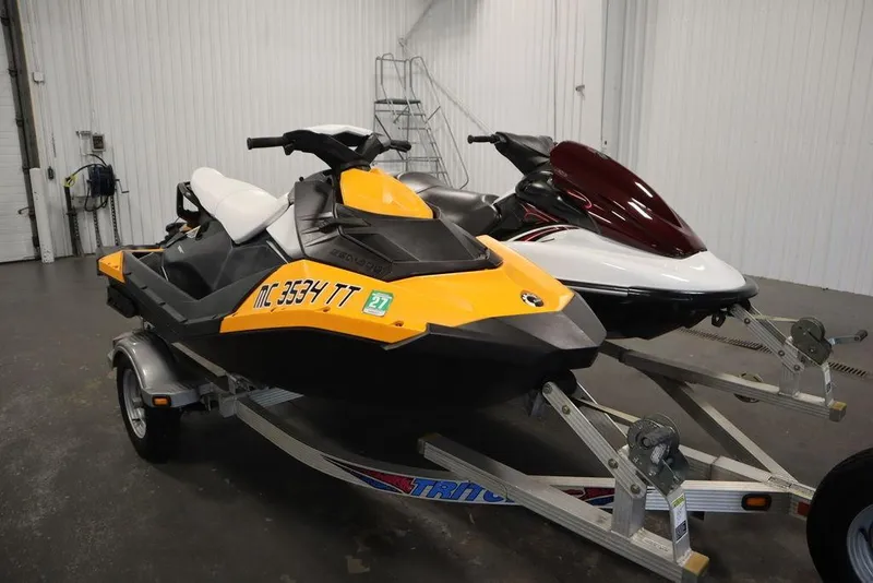 Slide: The Image of 2015 Sea-Doo Spark for 3 jet ski on trailer in garage. - 4