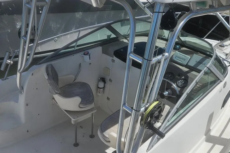 Slide: The Image of 2002 Bayliner Trophy Walkaround boat interior with steering wheel and seating. - 3