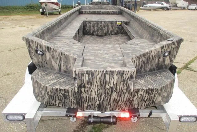 Slide: The Image of 2026 Reaper Boats 753-1688 camo-patterned boat on trailer, rear view. - 3