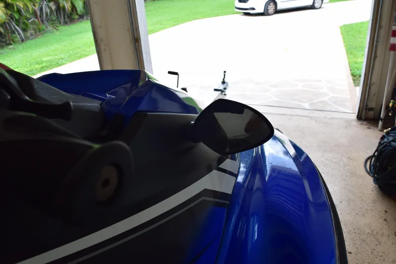 Slide: The Image of 2018 Yamaha WaveRunner EX Deluxe in a garage, with a driveway view. - 11