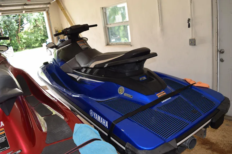 Slide: The Image of 2018 Yamaha WaveRunner EX Deluxe in a garage, blue and black design. - 5