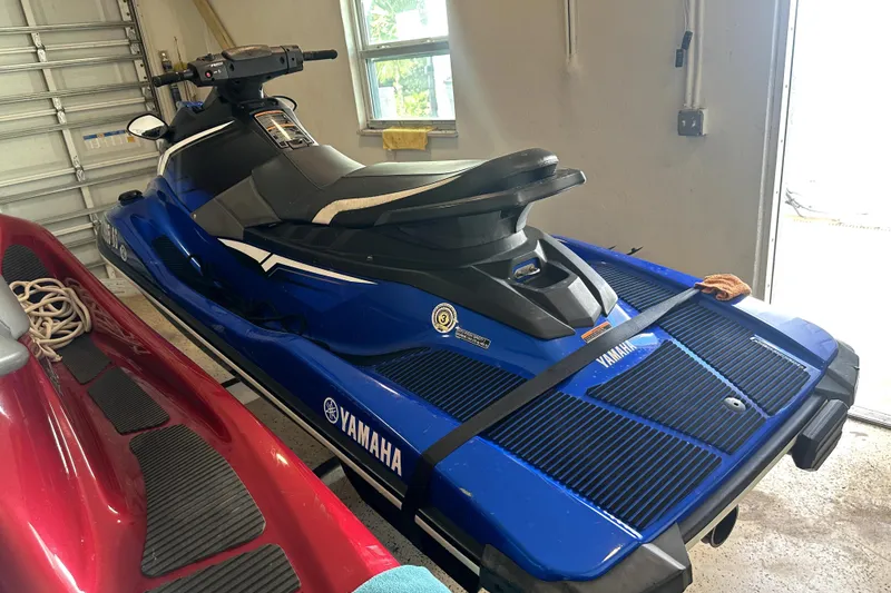 Slide: The Image of 2018 Yamaha WaveRunner EX Deluxe in a garage, blue and black design. - 7