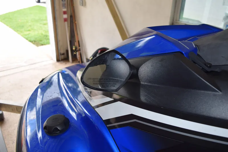 Slide: The Image of 2018 Yamaha WaveRunner EX Deluxe in a garage, showcasing sleek blue design. - 9