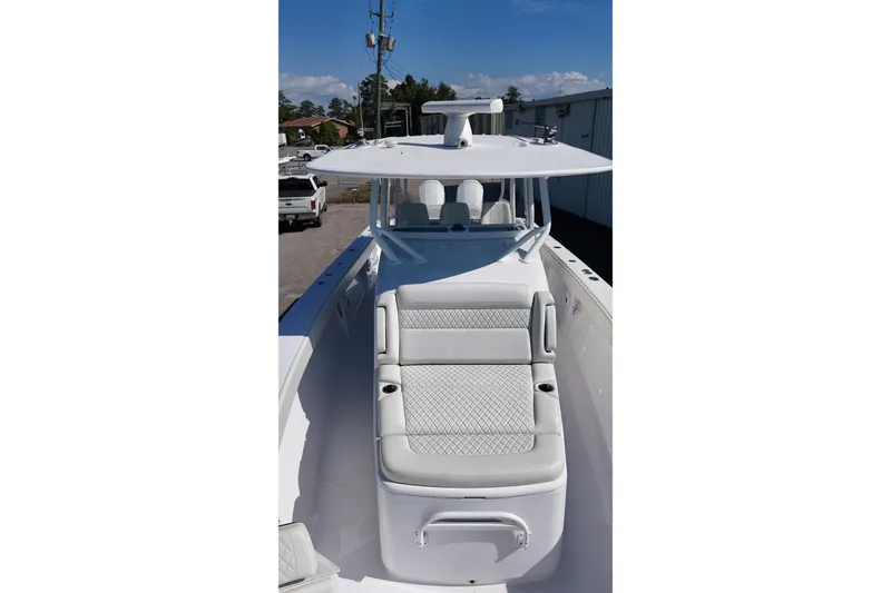 Slide: The Image of 2023 Jupiter 40 boat with sleek white seating and modern design. - 14