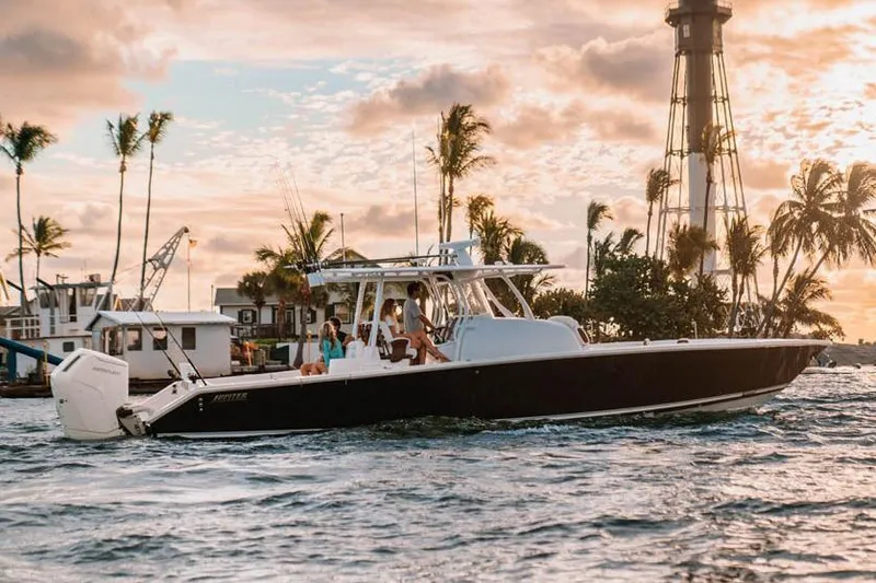 Slide: The Image of 2023 Jupiter 40 boat on trailer, featuring sleek design and powerful Mercury engine. - 2