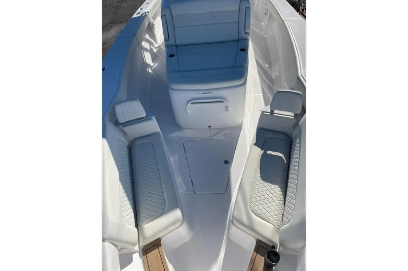 Slide: The Image of 2023 Jupiter 40 boat interior with cushioned seating and sleek design. - 24