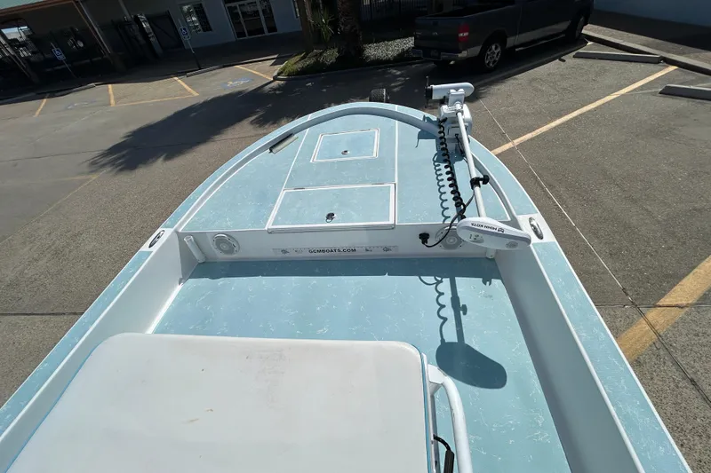 Slide: The Image of 2016 Shallow Sport 21 Sport boat with trolling motor in parking lot. - 14