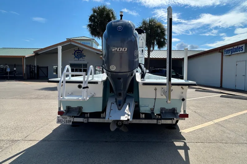Slide: The Image of 2016 Shallow Sport 21 Sport boat with Yamaha 200 engine, parked outdoors. - 7