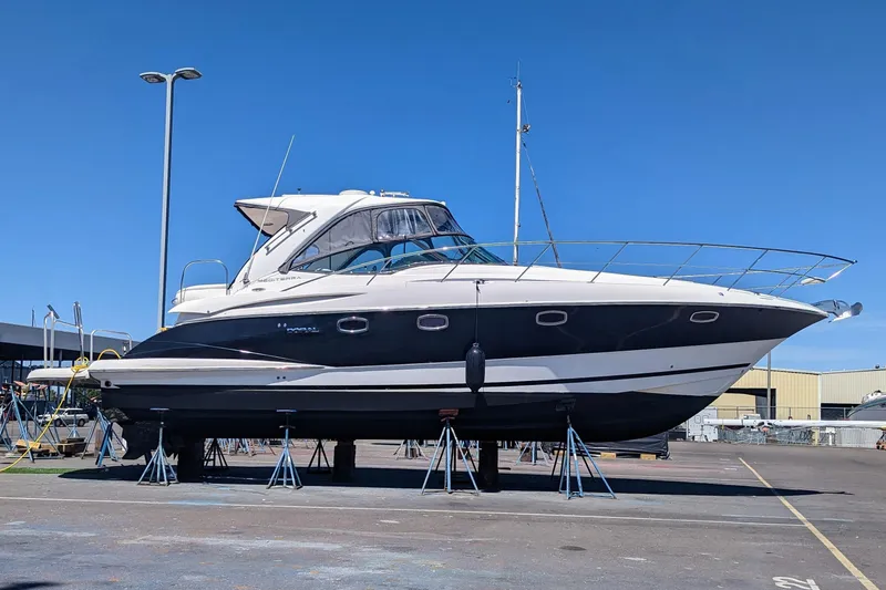 The Image of 2007 Doral 40 MEDITERRA yacht on stands in a marina under clear blue sky. - 0