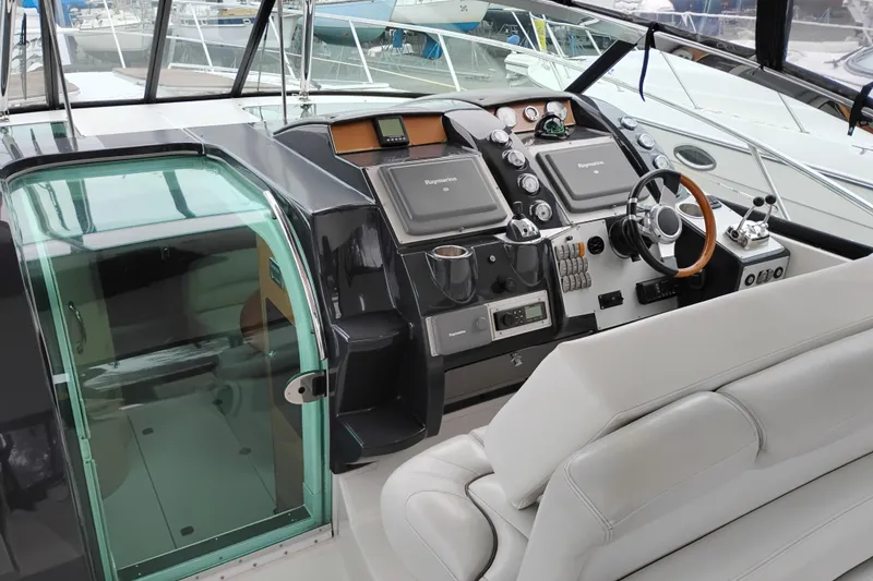Slide: The Image of 2007 Doral 40 Mediterra yacht cockpit with modern navigation controls and plush seating. - 12