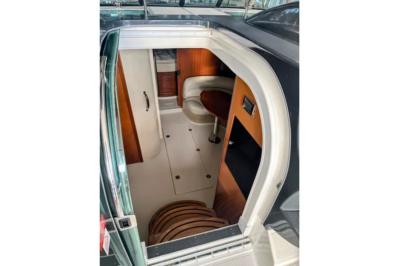 Slide: The Image of Interior view of 2007 Doral 40 MEDITERRA yacht cabin with seating and wood accents. - 13