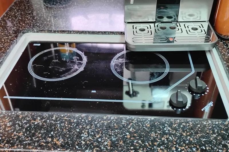 Slide: The Image of Glass cooktop with two burners on a 2007 Doral 40 MEDITERRA yacht kitchen. - 15