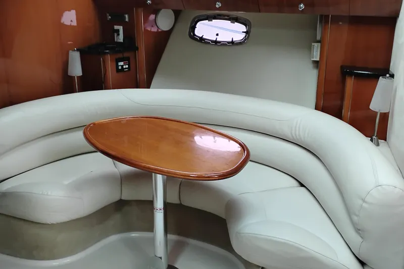 Slide: The Image of Luxurious interior of 2007 Doral 40 MEDITERRA yacht with white leather seating and wooden table. - 18