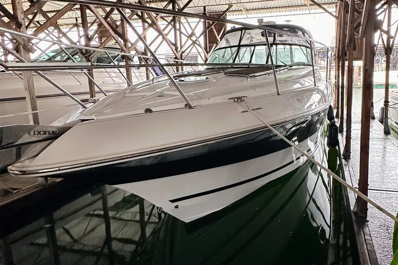 Slide: The Image of 2007 Doral 40 MEDITERRA yacht docked in a covered marina. - 2