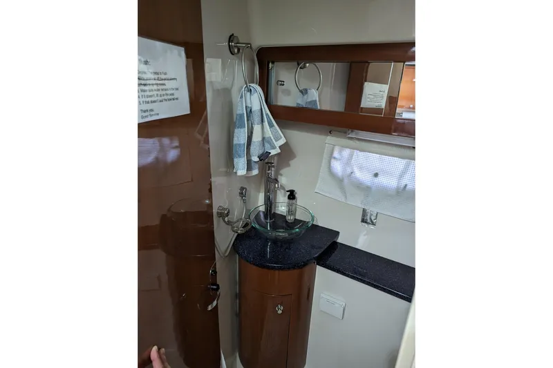 Slide: The Image of 2007 Doral 40 Mediterra yacht bathroom with glass sink and mirror. - 21