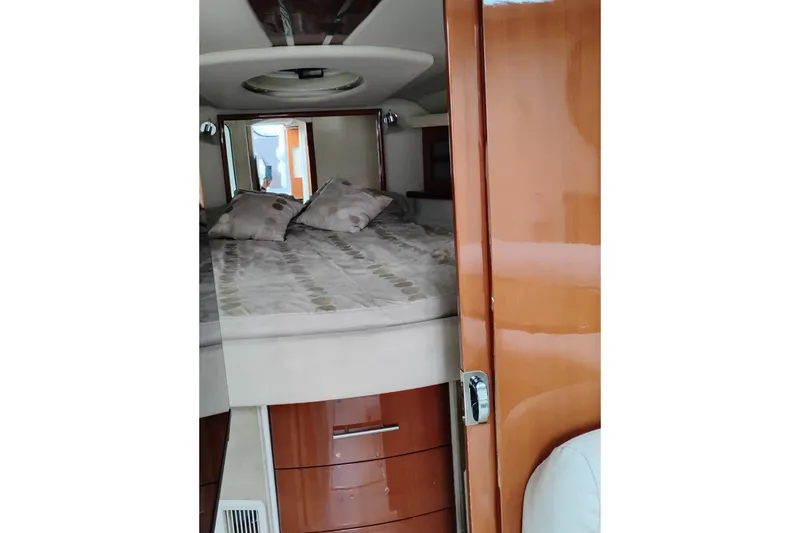 Slide: The Image of 2007 Doral 40 MEDITERRA yacht interior with cozy bed and wooden cabinetry. - 22