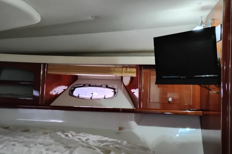 Slide: The Image of Interior of 2007 Doral 40 MEDITERRA yacht with TV and porthole window. - 23
