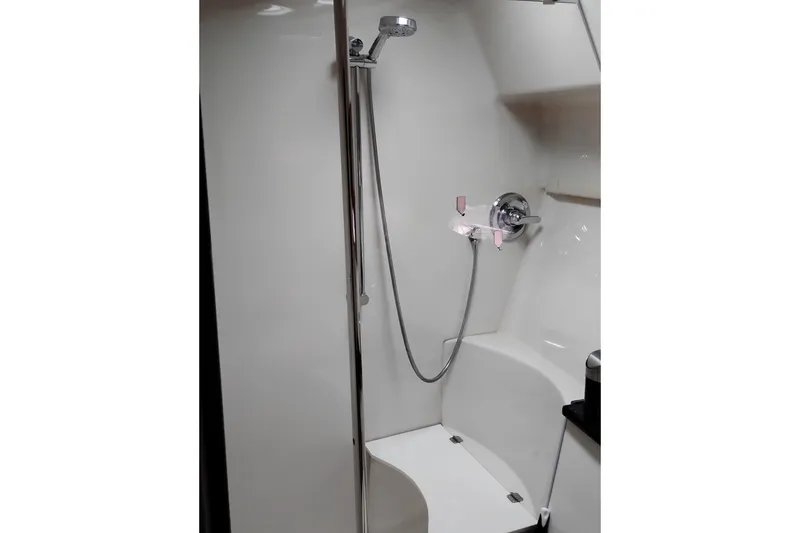 Slide: The Image of Shower area in 2007 Doral 40 MEDITERRA yacht, featuring chrome fixtures and white interior. - 24