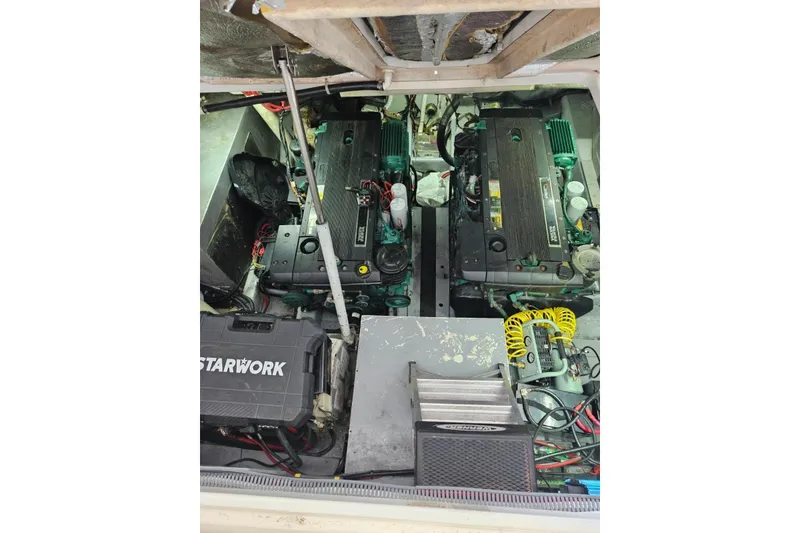 Slide: The Image of Engine compartment of a 2007 Doral 40 MEDITERRA boat, featuring dual engines and equipment. - 29