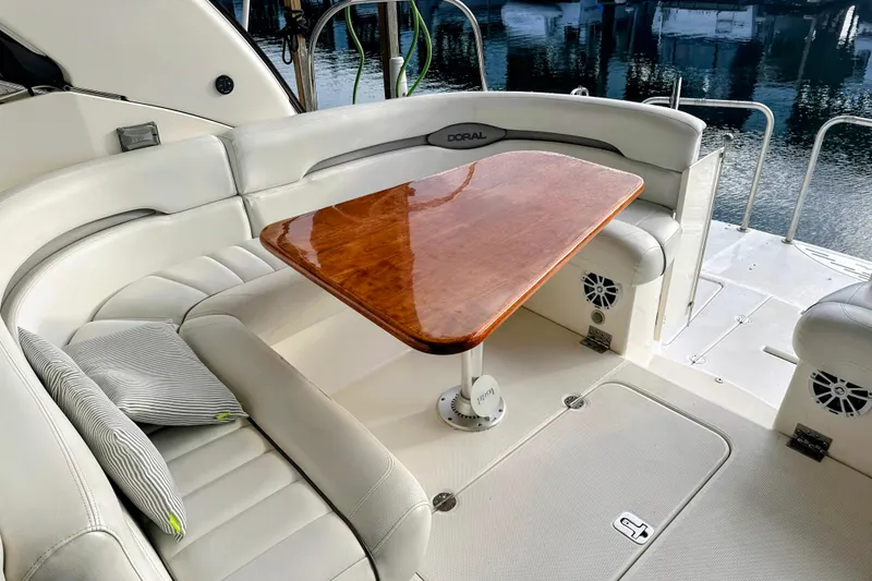 Slide: The Image of Luxurious seating area on a 2007 Doral 40 MEDITERRA yacht with wooden table. - 7