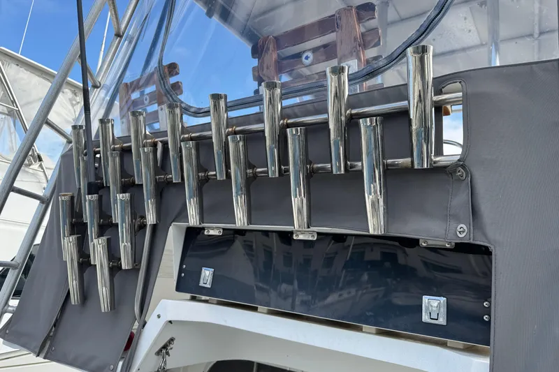 Slide: The Image of 1993 Blackfin Sportfisher boat with multiple stainless steel rod holders on deck. - 13