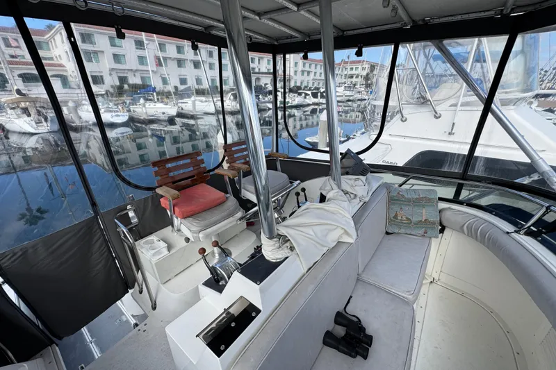 Slide: The Image of Interior view of a 1993 Blackfin Sportfisher boat docked at a marina. - 16