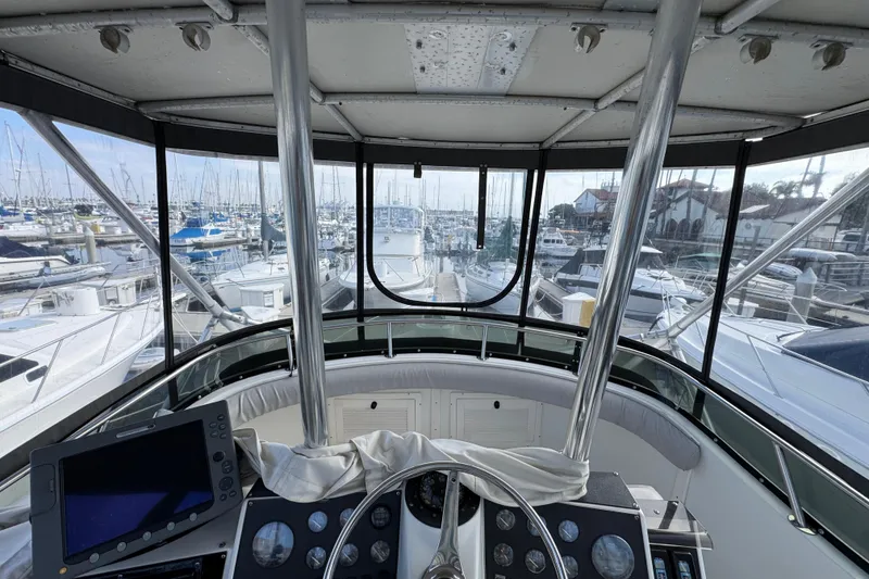 Slide: The Image of 1993 Blackfin Sportfisher boat cockpit view in marina, surrounded by yachts and sailboats. - 19