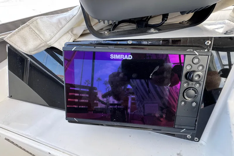 Slide: The Image of Simrad marine display on 1993 Blackfin Sportfisher boat dashboard. - 24