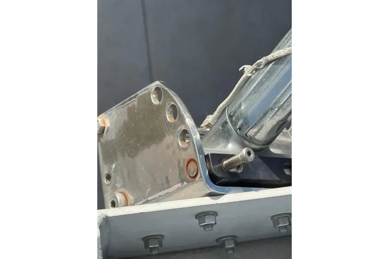 Slide: The Image of Close-up of a 1993 Blackfin Sportfisher boat component with metal bolts and fittings. - 36