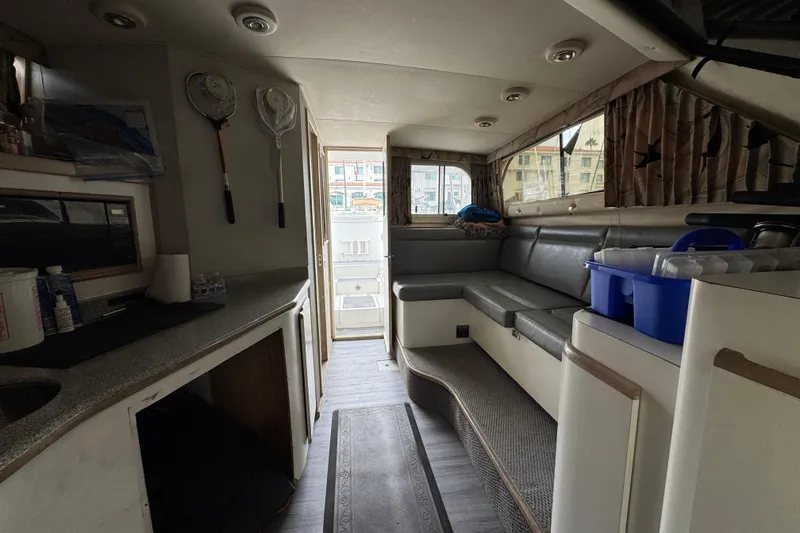 Slide: The Image of Interior of a 1993 Blackfin Sportfisher boat with seating and fishing gear. - 46