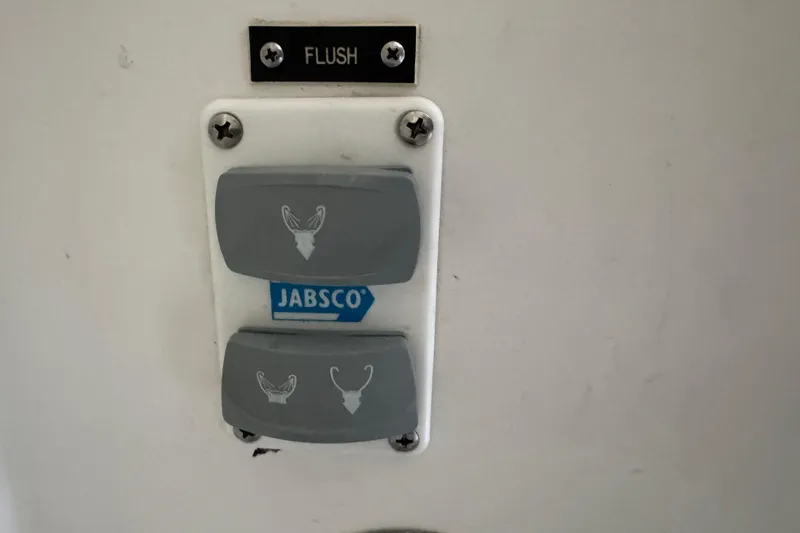 Slide: The Image of Jabsco marine toilet flush controls on 1993 Blackfin Sportfisher boat. - 51