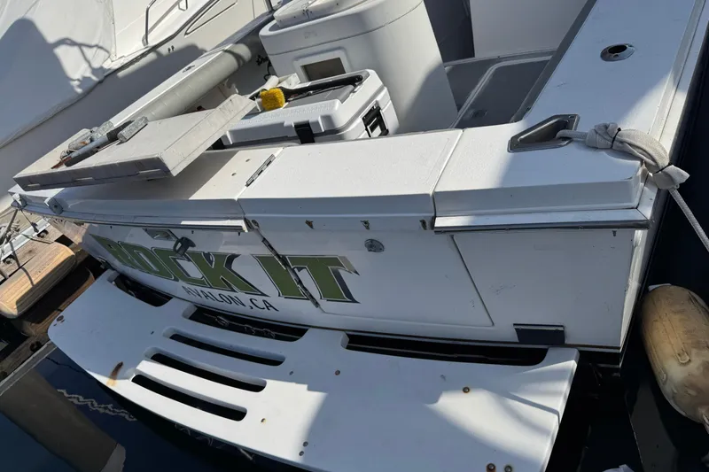 Slide: The Image of 1993 Blackfin Sportfisher boat stern with "Rock It" text, docked in Avalon, CA. - 8