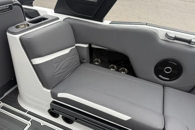 Slide: The Image of 2025 Supra SL 575 boat interior with gray seating and integrated speaker system. - 6