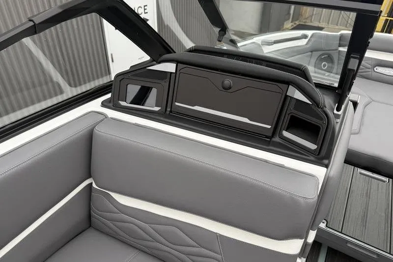Slide: The Image of 2025 Supra SL 575 boat interior with sleek gray seating and modern design elements. - 7