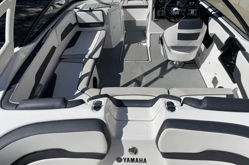Slide: The Image of 2023 Yamaha Boats AR195 interior with sleek seating and modern dashboard design. - 4