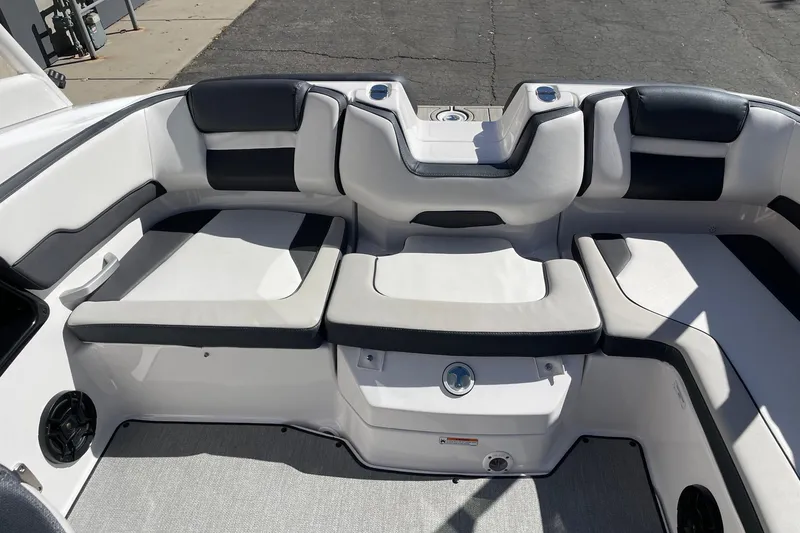 Slide: The Image of 2023 Yamaha Boats AR195 interior seating with black and white upholstery. - 8